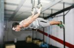 Man Balancing On Ring Stock Photo