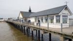 People Strolling Along Southwold Pier Stock Photo