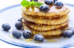 Pile Of Pancakes With Blueberries Sprinkled With Icing Sugar And Stock Photo