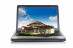 House On Laptop Stock Photo