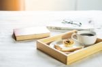 Morning Coffee Bread And Book Or Newspaper On The Bed Stock Photo