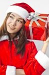 Santa Claus Hat With Red Christmas Gift Box Stock Photo