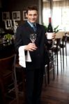 Man Posing With A Bottle Of Wine Stock Photo