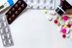 Top View Of The Pills On The White Background, Pack Of Tablet Drug And Capsule Pills On The Floor Stock Photo