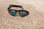 Glasses For Swimming On A Cement Floor With Small Stone Near Swi Stock Photo