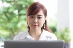 Portrait Of Thai Adult Businesswoman Beautiful Girl Using Computer Notebook Stock Photo