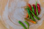 Chili On Wood Chopping Block Stock Photo