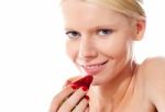 Young Lady Holding A Strawberry Stock Photo