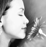 Relaxed Calm Girl Smelling A Big Flower Stock Photo