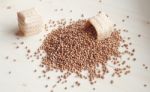 Pouring Spice Seed On The Wooden Board Stock Photo