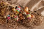 Colorful Painted Easter Egg From Fabric Bag On Hay Stock Photo