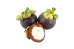 Half Opened Mangosteen And Two Whole On White Background Stock Photo