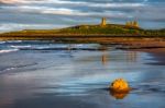 Sunset At Dunstanburgh Castle Stock Photo