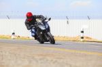 Young Man Riding Big Bike Motorcycle On Sharp Curve Asphalt Road Stock Photo