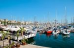 Assortment Of Boats And Yachts Moored At The Marina In Barcelona Stock Photo