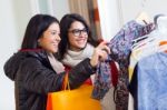 Two Beautiful Girls Shopping In A Clothes Shop Stock Photo