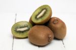 Tasty Kiwi Fruits Isolated On A White Wooden Background Stock Photo