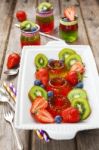 Red And Green Jelly Served With Fruit Stock Photo