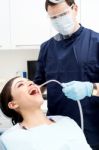 Dentist Examine On A Female Patient Stock Photo