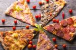 Pizza Cuts On Wooden Table Stock Photo