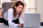 Woman In Kitchen With Laptop Stock Photo