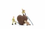 Miniature Worker Making Heart Shaped Chocolate On White Background , Stock Photo