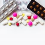 Top View Of The Pills On The White Background, Pack Of Tablet Drug And Capsule Pills On The Floor Stock Photo