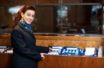 Female Receptionist Holding Records Stock Photo