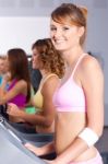 Group Of Women Running On Treadmill Stock Photo