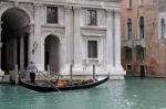 Venice, Italy - October 26 : Gondolier Rowing Along A Canal In V Stock Photo