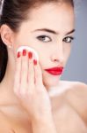 Woman Applying Make Up With Sponge Stock Photo