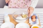 Woman Baking Healthy Muffin With Olive Oil Stock Photo