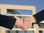 Handshaking Business People Stock Photo