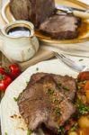 Roast Beef Joint With Roast Vegetables Stock Photo