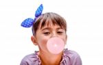 Portrait Of A Beautiful Little Girl Blowing Bubbles Stock Photo