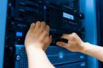 Man Fix Server Network In Data Center Room Stock Photo