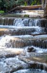 The Water Flowing Over Rocks And Trees Down A Waterfall At Huay Mae Khamin Waterfall National Park ,kanchana Buri In Thailand Stock Photo