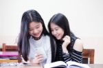 Two Asia Thai High School Student Uniform Best Friends Beautiful Girl Reading Book Stock Photo