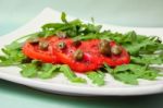 Salad With Fresh Tomatoes, Capers And Arugula Stock Photo