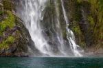 Waterfall At Milford Sound Stock Photo