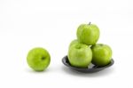 Green Apple With Plate Stock Photo