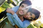 Outdoor Portrait Of Young Caucasian Couple At The Park Stock Photo