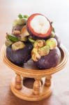 Group Of Mangoesteen On Wooden Tray Stock Photo