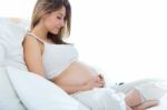 Pregnant Woman Relaxing At Home Stock Photo