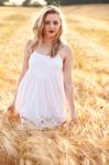 Portrait Of Beautiful Girl In Field Stock Photo