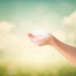 Hands Of Little Girl On Natural Background Stock Photo