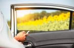 Travelers Checks Mobile Phones On Car Stock Photo