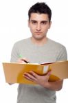 Man Studying With Dossier Stock Photo