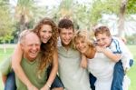 Young Generation Enjoying Piggyride Stock Photo