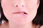 Woman Biting On Her Lip Stock Photo